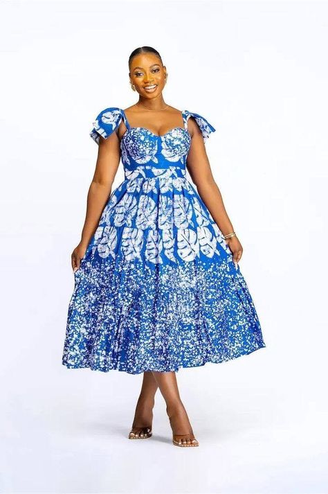 model wearing an african print dress