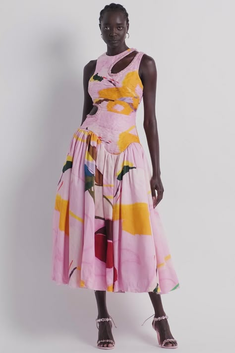 model wearing an african print dress